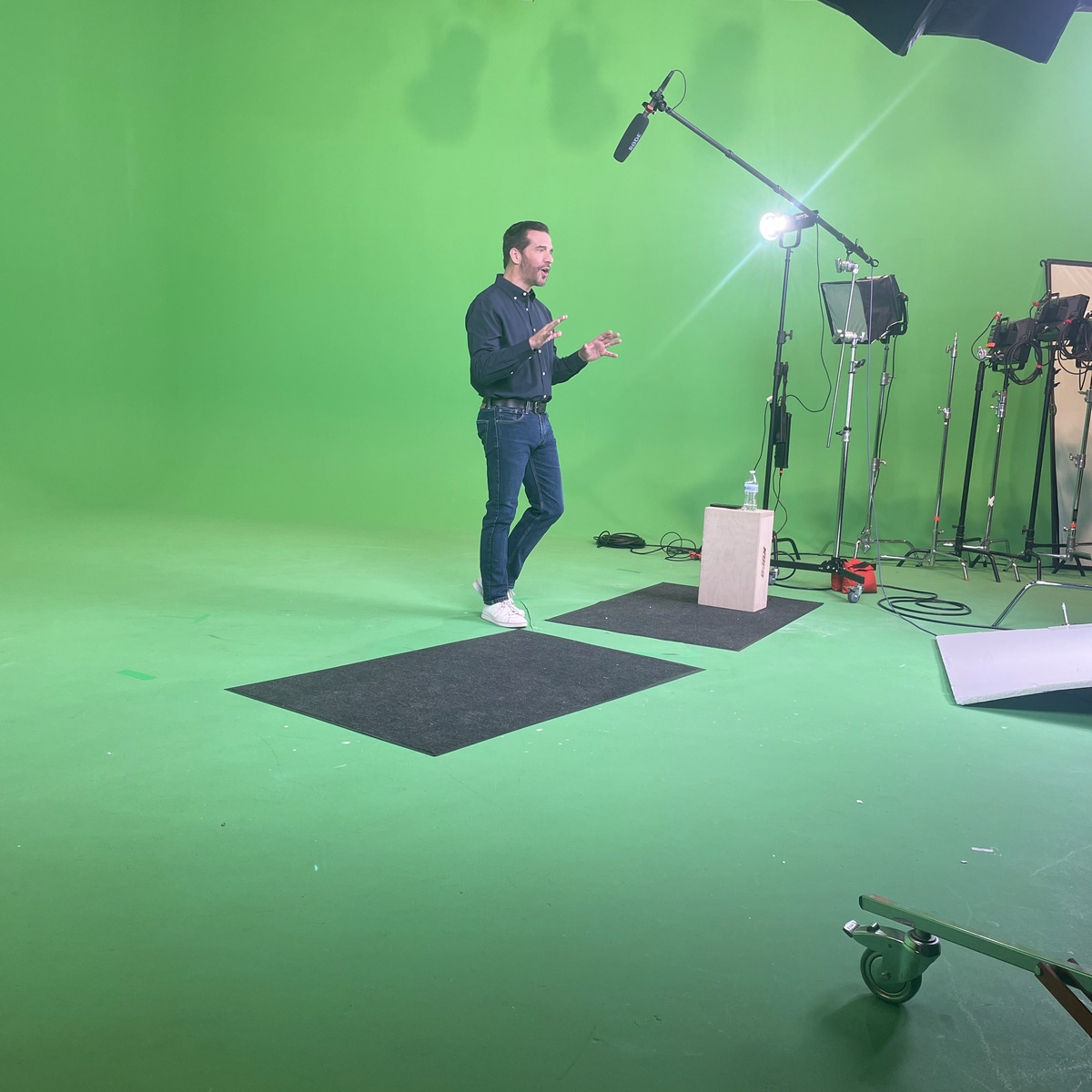 JD Roberto performing on a green screen stage